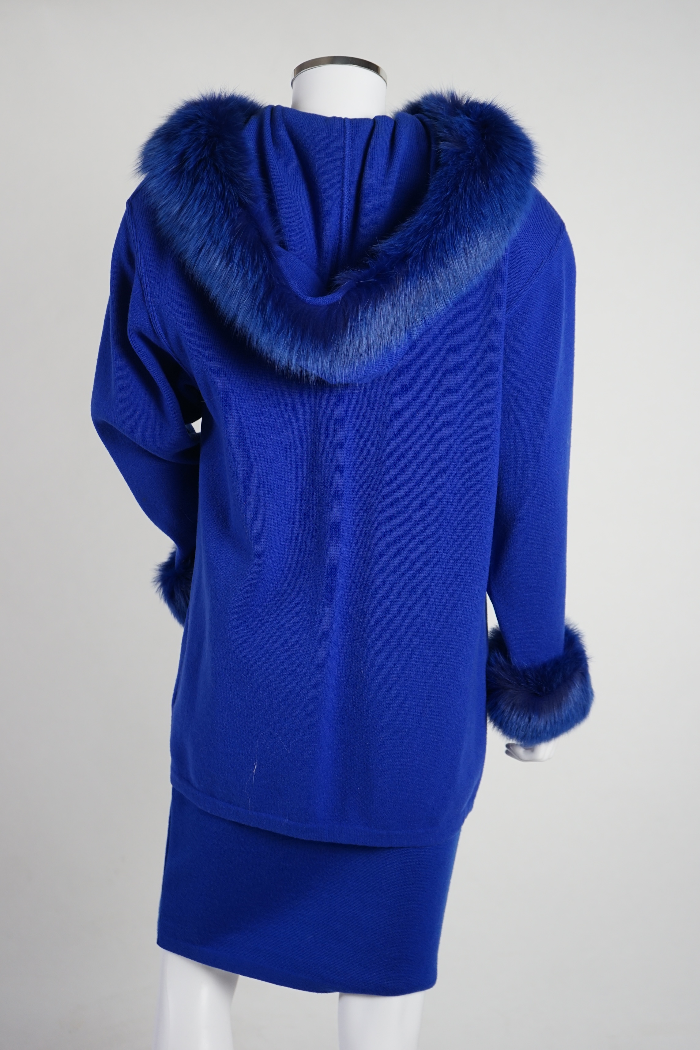 A Vera da Pozzo knitted royal blue suit with fur detail, knitted dress with fur cuffs and additional knitted skirt. Approx size 10-12 Proceeds to Happy Paws Puppy Rescue